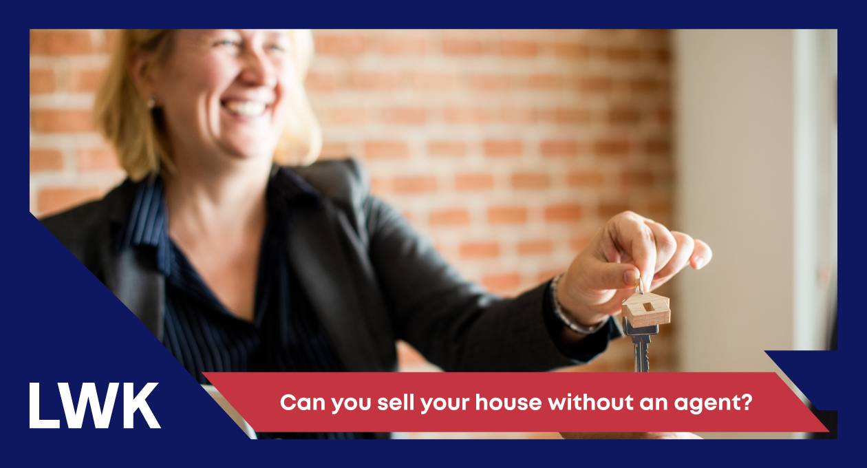 Image of lady handing keys over to someone who bought a house under the fair deal scheme
